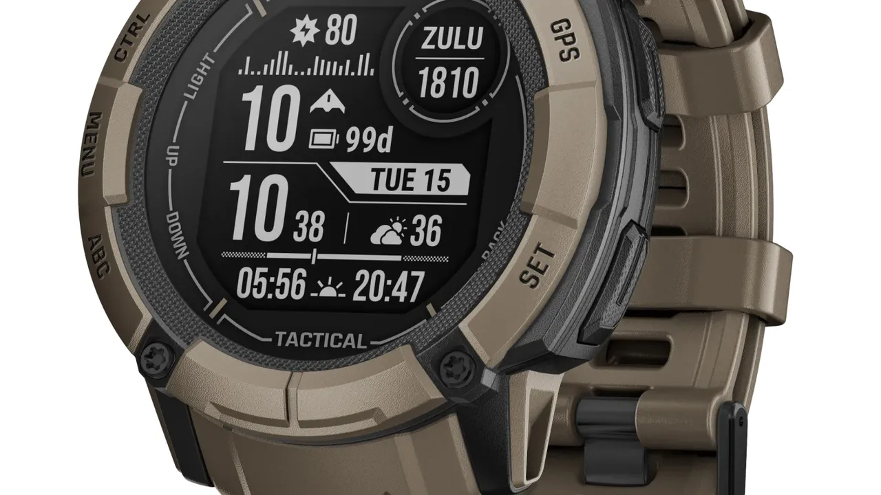 blue bowl of black bean beef tortilla soup on a board with cilantro and shredded cheese in background