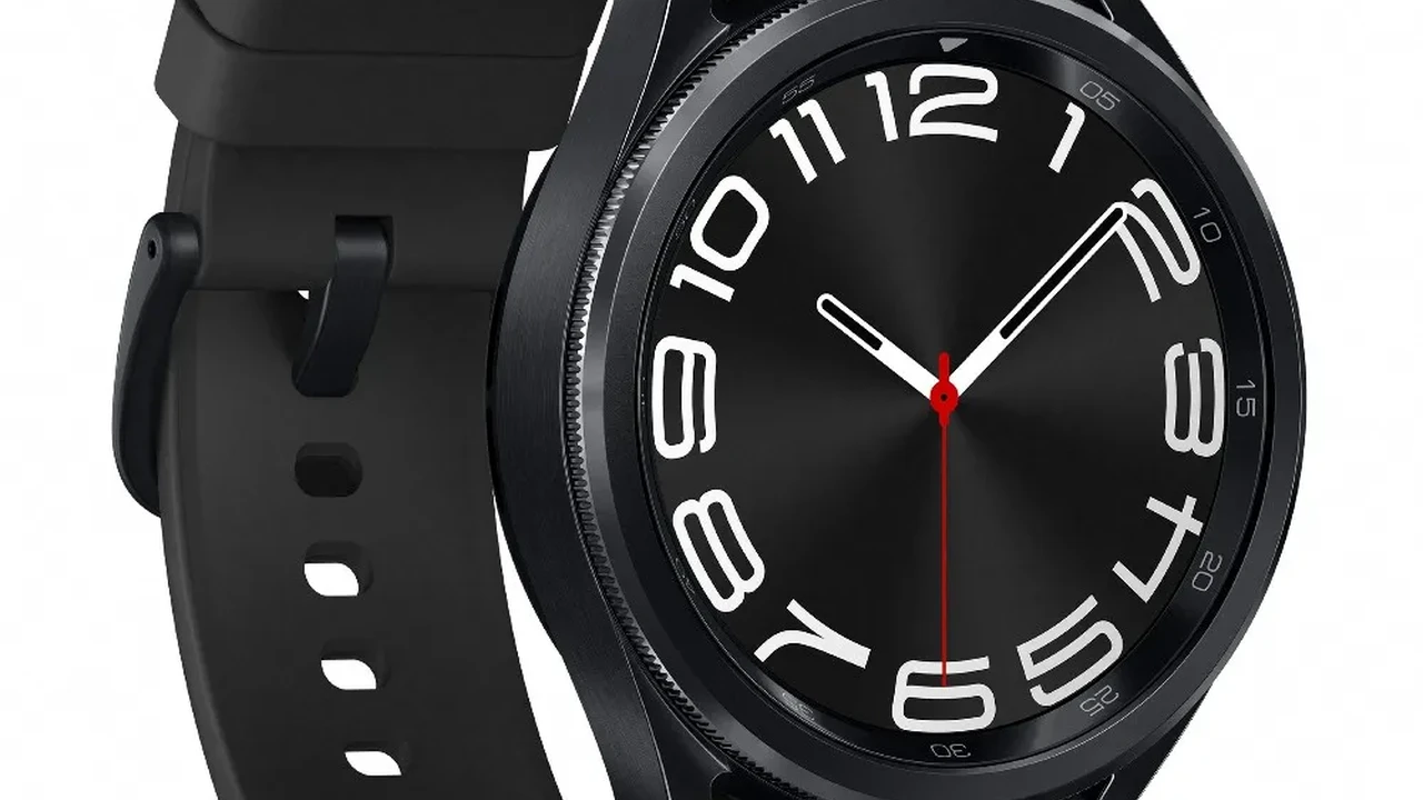 Close up on a plate of mashed potatoes, topped with baked pork chops with cream of mushroom soup, and a side of green beans.