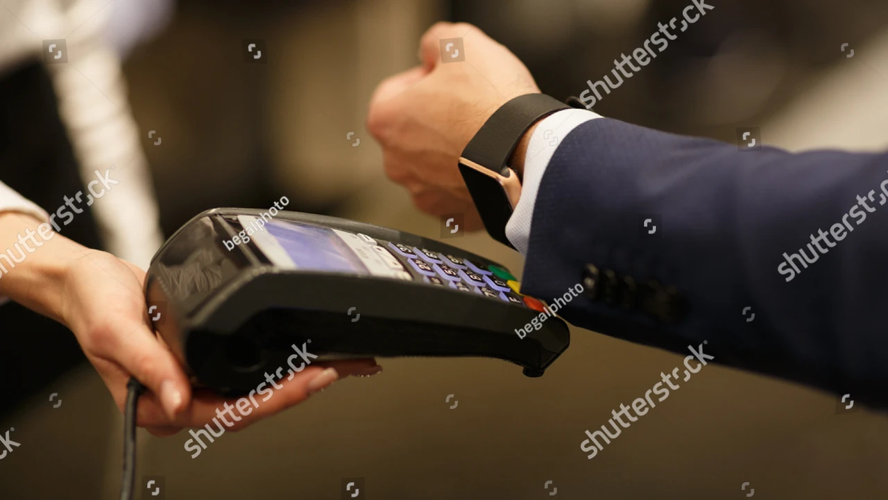 Close up on a plate of mashed potatoes, topped with baked pork chops with cream of mushroom soup, and a side of green beans.