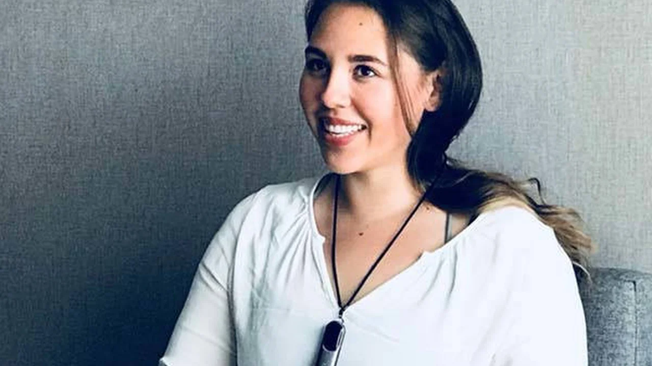Close up on a plate of mashed potatoes, topped with baked pork chops with cream of mushroom soup, and a side of green beans.